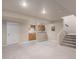 Finished basement featuring neutral carpet, wet bar area with cabinetry, and stairs to the upper level at 1660 Moveen Hts, Monument, CO 80132