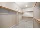 Spacious walk-in closet featuring multiple shelves and ample hanging space for organized storage at 1660 Moveen Hts, Monument, CO 80132