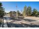 Inviting entrance to Brookmoor Estates showcases well-maintained landscaping and signage at 1660 Moveen Hts, Monument, CO 80132