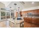 Bright kitchen with granite counters, custom cabinets, stainless appliances, hardwood floors, and modern pendant lighting at 1660 Moveen Hts, Monument, CO 80132