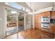 Bright breakfast nook with stainless steel appliances, hardwood floors, and sliding glass doors at 1660 Moveen Hts, Monument, CO 80132