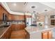 This gourmet kitchen features stainless appliances, a large center island with granite counters, and custom cabinets at 1660 Moveen Hts, Monument, CO 80132