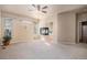 Primary bedroom featuring a fireplace and arched entry to the primary bath at 1660 Moveen Hts, Monument, CO 80132