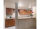 Basement wet bar features wooden cabinets, countertop, wine rack and recessed lighting at 1660 Moveen Hts, Monument, CO 80132
