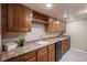 Basement wet bar area with wooden cabinetry, sink, wine rack, and countertop space for entertaining at 1660 Moveen Hts, Monument, CO 80132