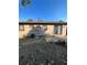 Home's backyard, showing a large grassy area and a shed at 16786 E Kent Dr, Aurora, CO 80013