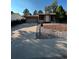 Ranch style home with a paved driveway and mature landscaping at 16786 E Kent Dr, Aurora, CO 80013