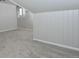 Finished attic space featuring neutral carpet, tongue and groove paneling, and natural light at 3745 Fairfax St, Denver, CO 80207