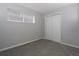 This bedroom features neutral walls, carpet floors and a window at 3745 Fairfax St, Denver, CO 80207