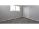 This bedroom features carpet flooring and a window at 3745 Fairfax St, Denver, CO 80207