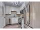 Modern kitchen features stainless steel appliances, white cabinets, and granite countertops at 3745 Fairfax St, Denver, CO 80207
