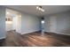 Spacious room with wood floors, neutral paint and modern lighting at 3745 Fairfax St, Denver, CO 80207