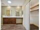 Bathroom features a skylight, wood flooring, double sinks and a large walk-in closet at 4835 Abo Ln, Monument, CO 80132