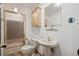 Bright bathroom features a stand up shower and pedestal sink at 4835 Abo Ln, Monument, CO 80132