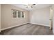 Bedroom featuring a window with views of the trees and carpeted floors at 4835 Abo Ln, Monument, CO 80132