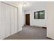 Cozy bedroom features a closet, window and neutral carpet at 4835 Abo Ln, Monument, CO 80132