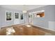 Bright dining room features wood floors, large windows, and easy access to the kitchen at 4835 Abo Ln, Monument, CO 80132