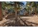 Exterior shows a modern gray home with floor-to-ceiling windows, stone accents, and a wooden porch at 4835 Abo Ln, Monument, CO 80132
