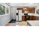 Functional kitchen offers tile flooring, sleek countertops, and ample cabinet space at 4835 Abo Ln, Monument, CO 80132