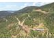 Aerial view of houses on a mountainside, showcasing the community and landscape at 1729 Santa Fe Mountain Rd, Evergreen, CO 80439