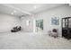 Spacious finished basement with large windows and sliding glass door at 1729 Santa Fe Mountain Rd, Evergreen, CO 80439