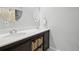Bathroom with double vanity and stylish dark brown cabinets at 1729 Santa Fe Mountain Rd, Evergreen, CO 80439