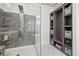 Spa-like bathroom with walk-in shower and built-in shelving at 1729 Santa Fe Mountain Rd, Evergreen, CO 80439