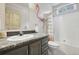 Charming bathroom with a flamingo-themed shower curtain at 1729 Santa Fe Mountain Rd, Evergreen, CO 80439