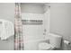 Clean bathroom with tub shower, mosaic accents, and neutral colors at 1729 Santa Fe Mountain Rd, Evergreen, CO 80439