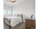 Bright bedroom with a queen-size bed and large windows at 1729 Santa Fe Mountain Rd, Evergreen, CO 80439
