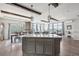Open kitchen features granite island and hardwood floors at 1729 Santa Fe Mountain Rd, Evergreen, CO 80439