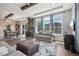 Open living area with stone fireplace and hardwood floors at 1729 Santa Fe Mountain Rd, Evergreen, CO 80439