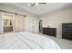 Main bedroom with barn door and ensuite bathroom at 1729 Santa Fe Mountain Rd, Evergreen, CO 80439