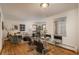 Open concept dining area with a glass table and four chairs at 7032 E 4Th Ave, Denver, CO 80220