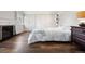 This bedroom features wood floors, a fireplace, and built-in closet storage at 6990 W 9Th Pl, Lakewood, CO 80214
