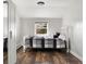 Cozy bedroom with a bed, built-in closet, and a window offering natural light at 6990 W 9Th Pl, Lakewood, CO 80214