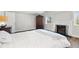 Bright bedroom with a decorative fireplace and large windows for natural light at 6990 W 9Th Pl, Lakewood, CO 80214