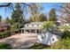Lovely home with a covered porch, detached garage, and ample parking space at 6990 W 9Th Pl, Lakewood, CO 80214
