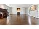 Expansive living room with fireplace, piano, and plenty of natural light at 6990 W 9Th Pl, Lakewood, CO 80214