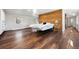 Large main bedroom with wood accent wall, hardwood floors, and an open, airy feel at 6990 W 9Th Pl, Lakewood, CO 80214