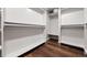 Spacious walk-in closet offers ample storage with built-in shelving and rods, perfect for organization at 6990 W 9Th Pl, Lakewood, CO 80214