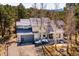 Aerial view of a beautiful home with a gray roof, surrounded by lush greenery and trees at 2122 Cramner Ct, Evergreen, CO 80439