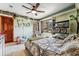 Inviting bedroom with a ceiling fan, windows, and playful decor at 2122 Cramner Ct, Evergreen, CO 80439
