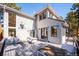 Outdoor deck features comfortable seating, a dining area, and views of the home's exterior at 2122 Cramner Ct, Evergreen, CO 80439