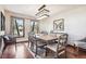 Formal dining room featuring hardwood floors, contemporary lighting, and large windows offer an elegant setting at 2122 Cramner Ct, Evergreen, CO 80439