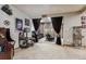 Fun game room setup with an arcade machine and home theater area at 2122 Cramner Ct, Evergreen, CO 80439