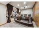 Basement home theater room with comfortable seating and a projector setup at 2122 Cramner Ct, Evergreen, CO 80439