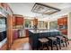 Gourmet kitchen boasts a large center island, stainless steel appliances, and adjacent dining area at 2122 Cramner Ct, Evergreen, CO 80439