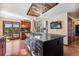 Open kitchen with custom wood cabinets, large island, and stainless steel appliances at 2122 Cramner Ct, Evergreen, CO 80439