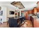 Gourmet kitchen boasts a large island, custom cabinets, and stainless steel appliances at 2122 Cramner Ct, Evergreen, CO 80439